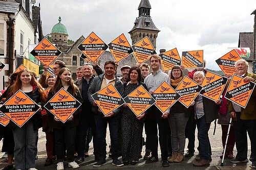 Glyn Preston surrounded by Lib Dem activists