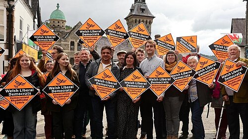 Glyn Preston surrounded by Lib Dem activists