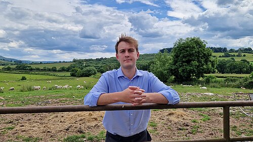 Cllr Glyn Preston on a farm.